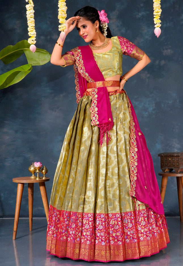 Woman in a chiku and pink traditional chaniya choli with dupatta