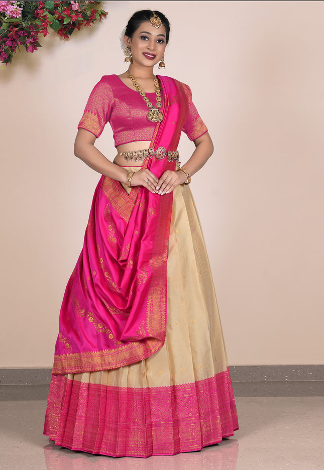 Woman wearing a pink and beige lehenga choli with dupatta