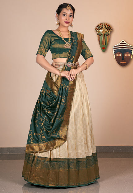 Woman wearing a traditional Chiku and beige saree with gold accents