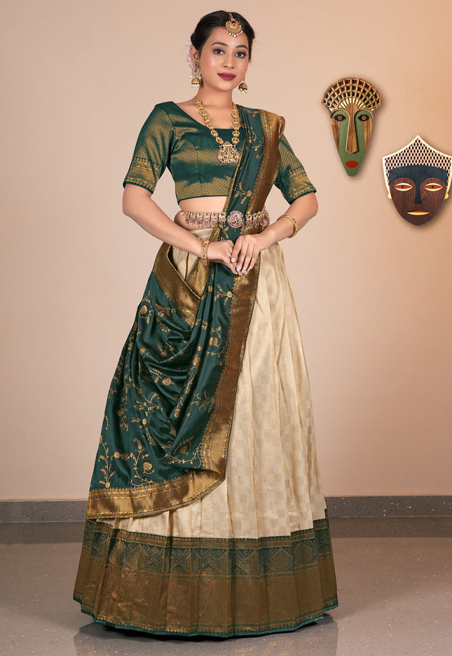 Woman wearing a traditional Chiku and beige saree with gold accents