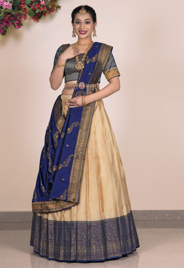 Woman wearing a blue and beige lehenga choli with dupatta