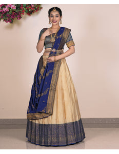 Woman wearing a blue and beige lehenga choli with dupatta