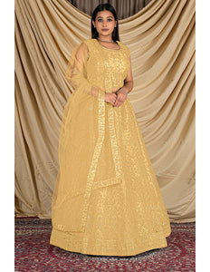Woman wearing a yellow embroidered traditional outfit