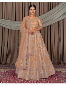 Woman in a beige embroidered traditional outfit