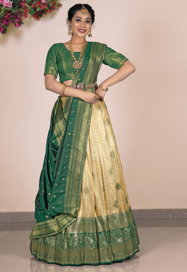 Woman wearing a green and beige lehenga choli