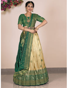 Woman wearing a green and beige lehenga choli