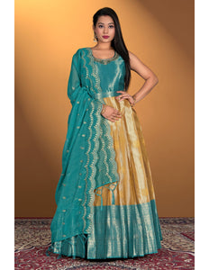 Woman wearing a traditional teal and gold gown 