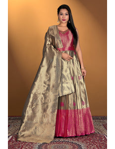 Woman wearing a traditional outfit with a gold dupatta