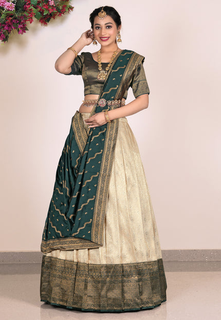 Woman wearing a traditional green and beige lehenga choli