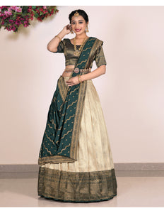 Woman wearing a traditional green and beige lehenga choli
