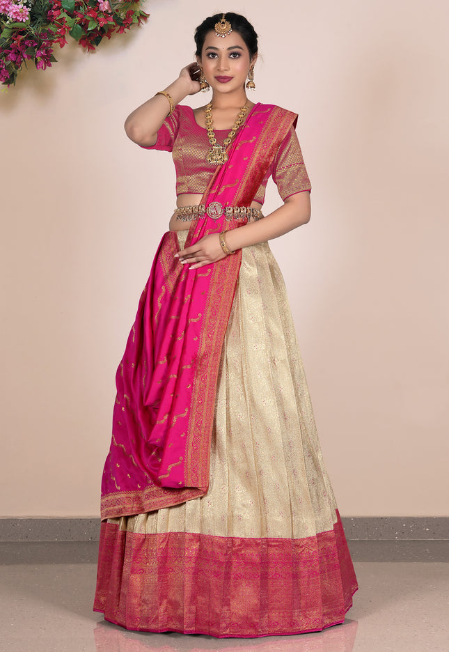 Woman wearing a pink and beige lehenga choli