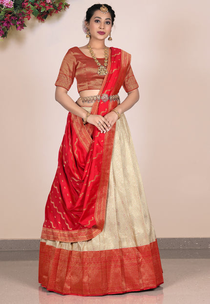 Woman wearing a red and beige lehenga