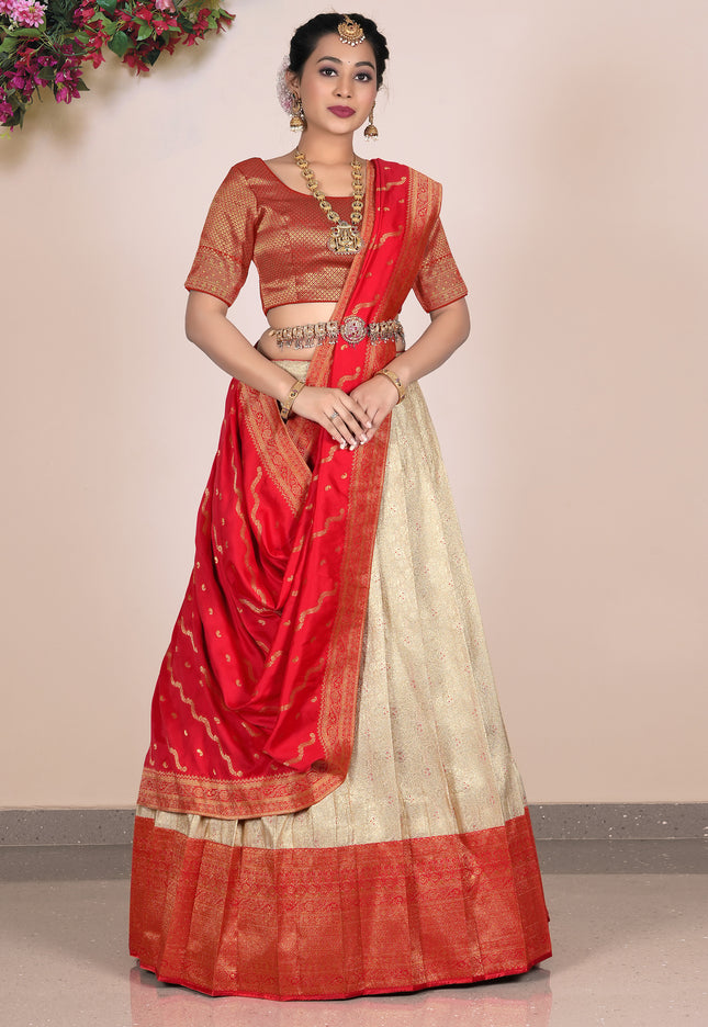 Woman wearing a red and beige lehenga