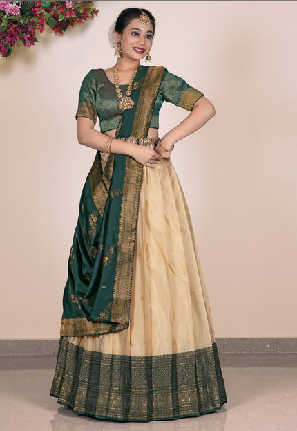 Woman wearing a green and beige lehenga