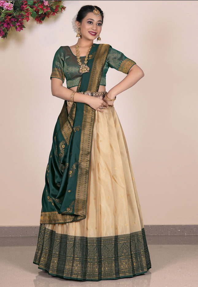 Woman wearing a green and beige lehenga