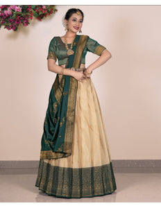 Woman wearing a green and beige lehenga