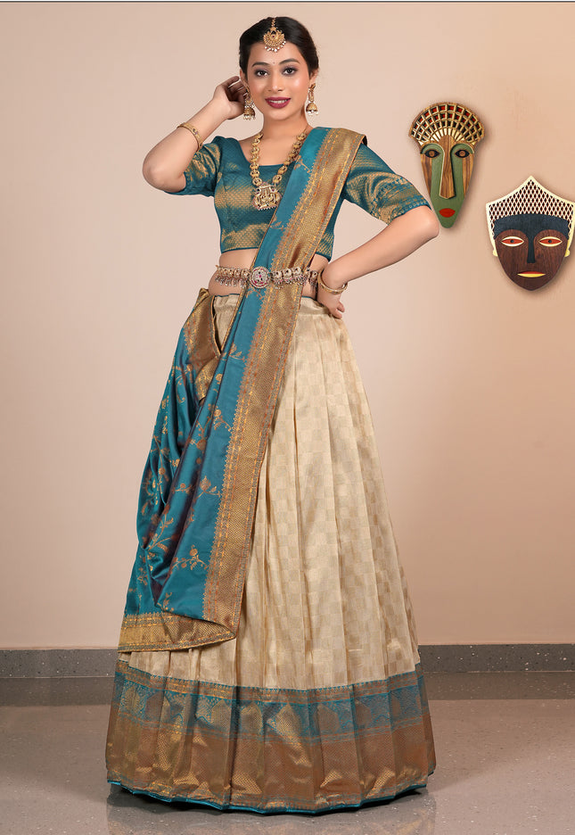 Woman in a traditional chiku-color half-saree