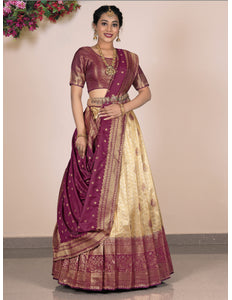 Woman wearing a traditional maroon and beige lehenga choli