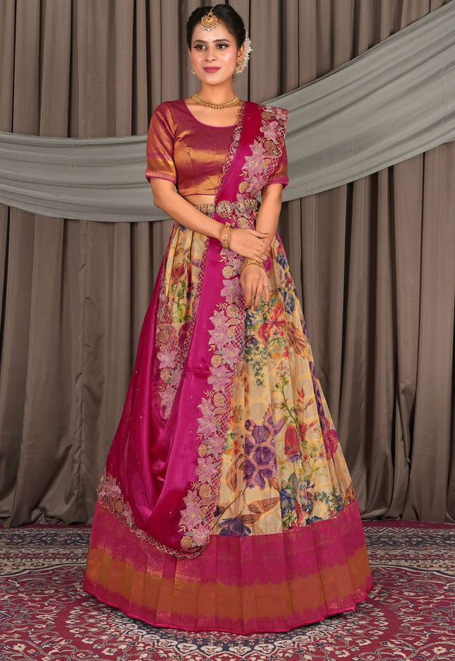 Woman wearing a traditional multicolored lehenga choli with a pink border