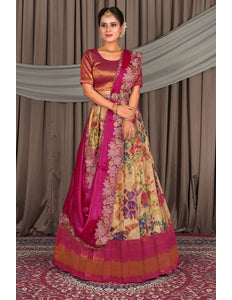 Woman wearing a traditional multicolored lehenga choli with a pink border