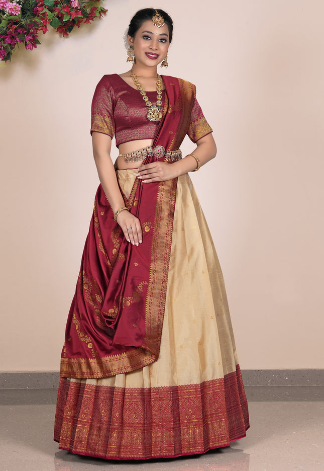 Woman wearing a traditional maroon and beige lehenga choli