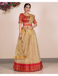 Woman wearing a traditional with a red blouse and beige skirt