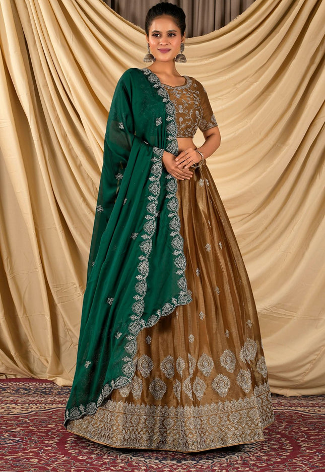Woman wearing a traditional lehenga choli with a green dupatta
