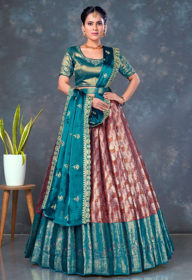 Woman wearing a traditional outfit with a teal and pink design
