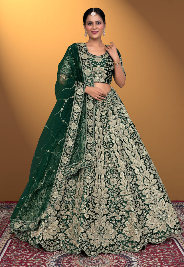 Woman wearing a green and white embroidered traditional lehenga choli