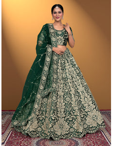 Woman wearing a green and white embroidered traditional lehenga choli