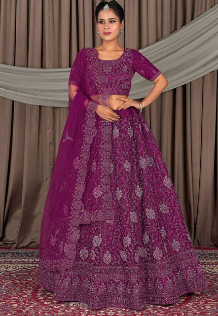 Woman wearing a traditional purple embroidered outfit