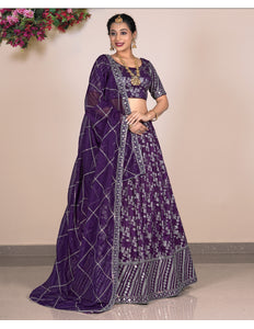 Woman wearing a purple lehenga choli
