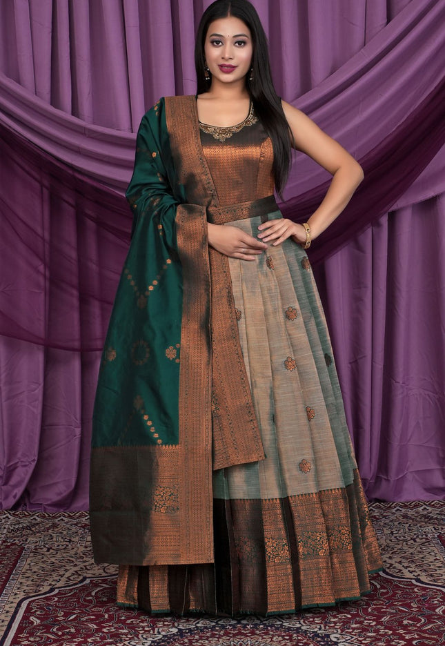 Woman wearing a traditional outfit with a green dupatta 