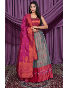 Woman wearing a traditional Gown with Dupatta