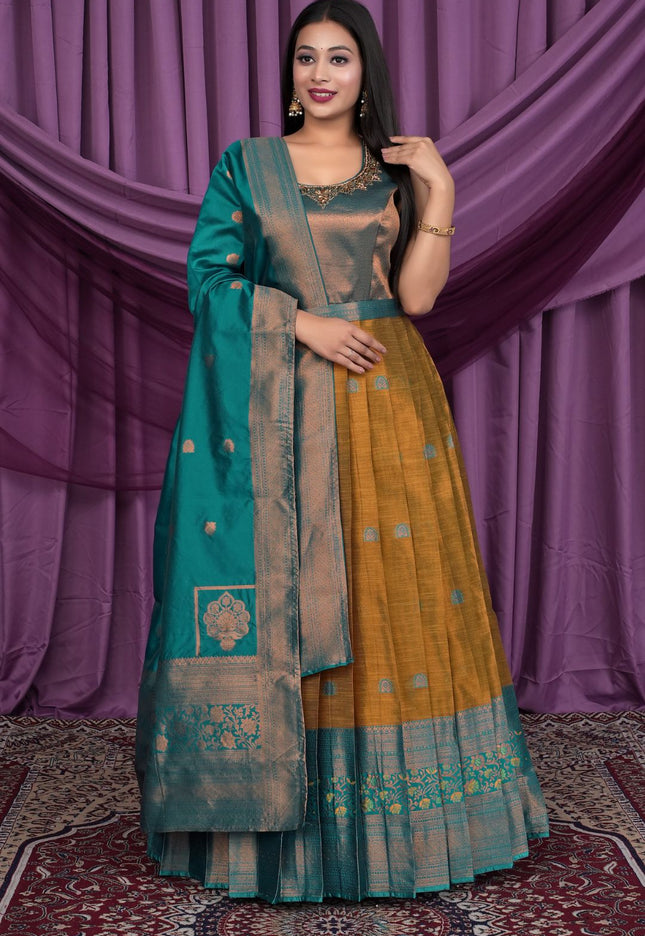 Woman wearing a traditional outfit with a teal and yellow Gown With Dupatta