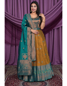Woman wearing a traditional outfit with a teal and yellow Gown With Dupatta