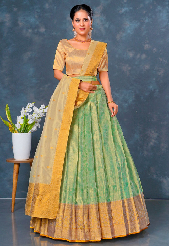 Woman wearing a traditional green and yellow outfit