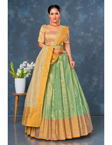 Woman wearing a traditional green and yellow outfit