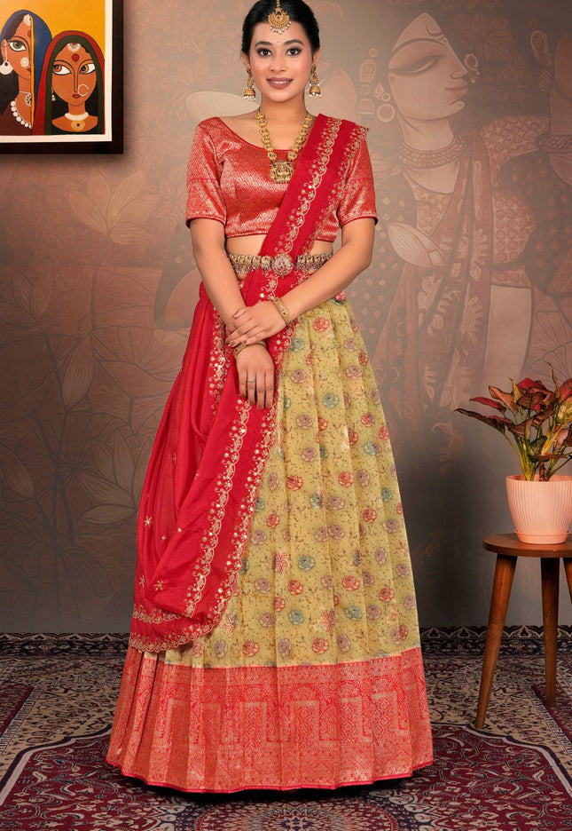 Woman in a red and yellow traditional lehenga choli
