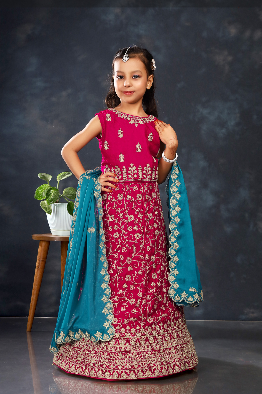 Young girl in a traditional Firozi-Rani Colour Kids Readymade Lehenga