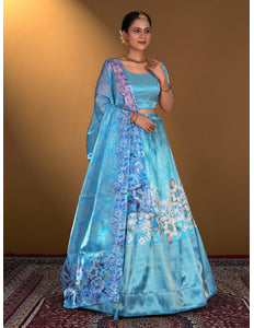 Woman wearing a blue floral lehenga choli
