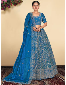 Woman wearing a blue embroidered lehenga choli