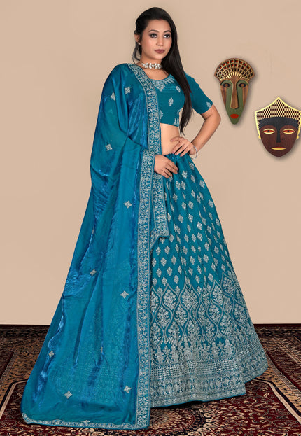 Woman wearing a blue lehenga choli
