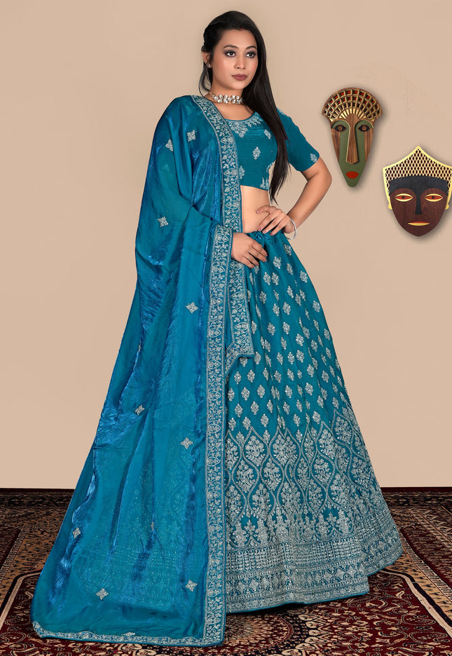Woman wearing a blue lehenga choli
