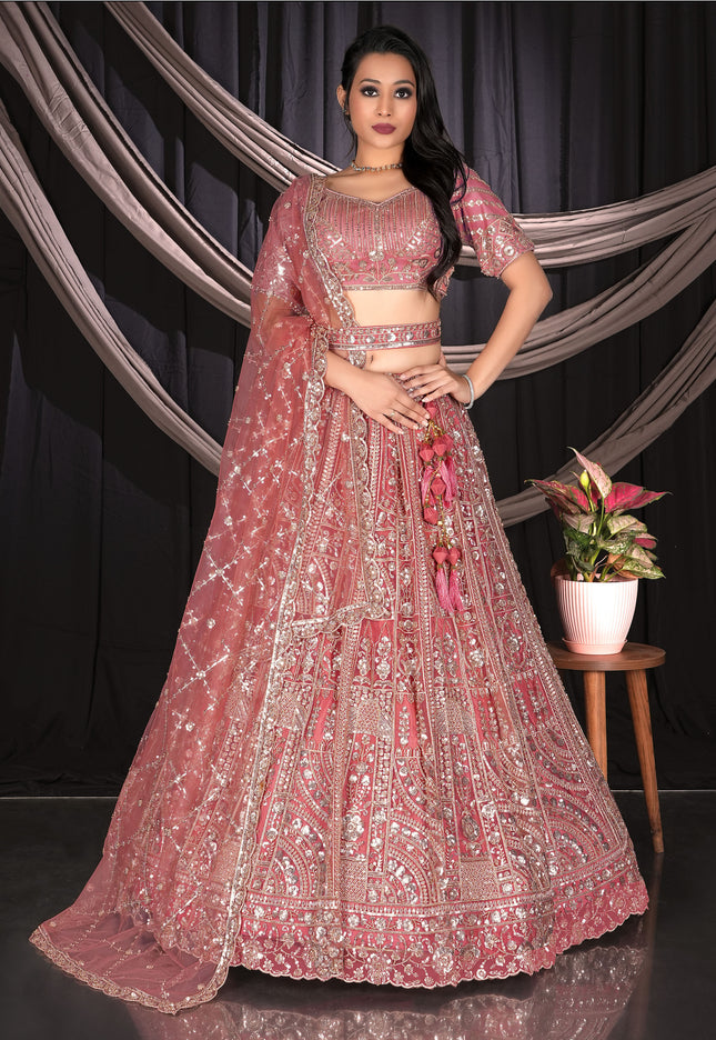 Woman in a pink embroidered traditional outfit