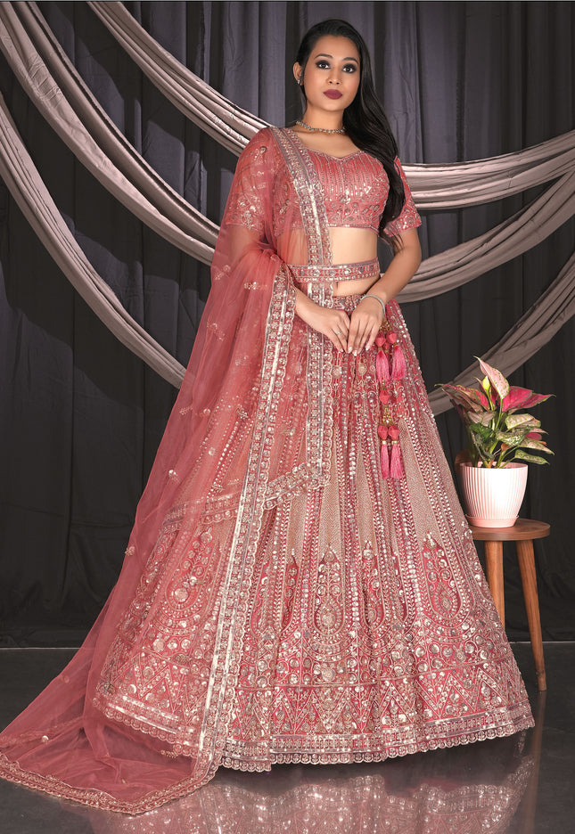 Woman in a traditional pink embroidered outfit