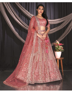 Woman in a traditional pink embroidered outfit