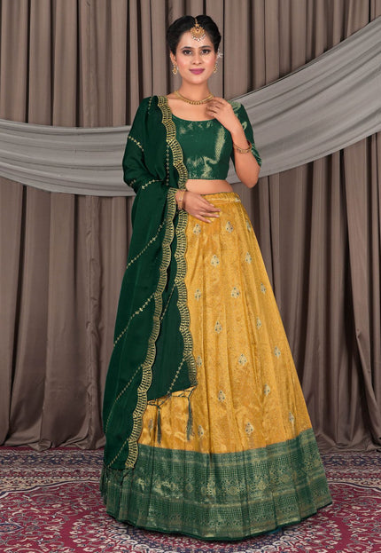 Woman wearing a green and yellow traditional lehenga choli