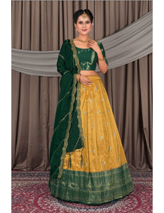 Woman wearing a green and yellow traditional lehenga choli