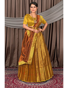 Woman wearing a traditional yellow and orange lehenga with a matching blouse